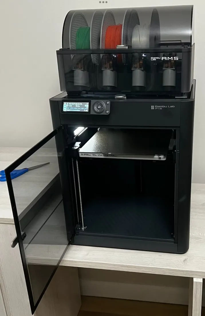 Bambu Lab P1S with its door open and an optional AMS on top