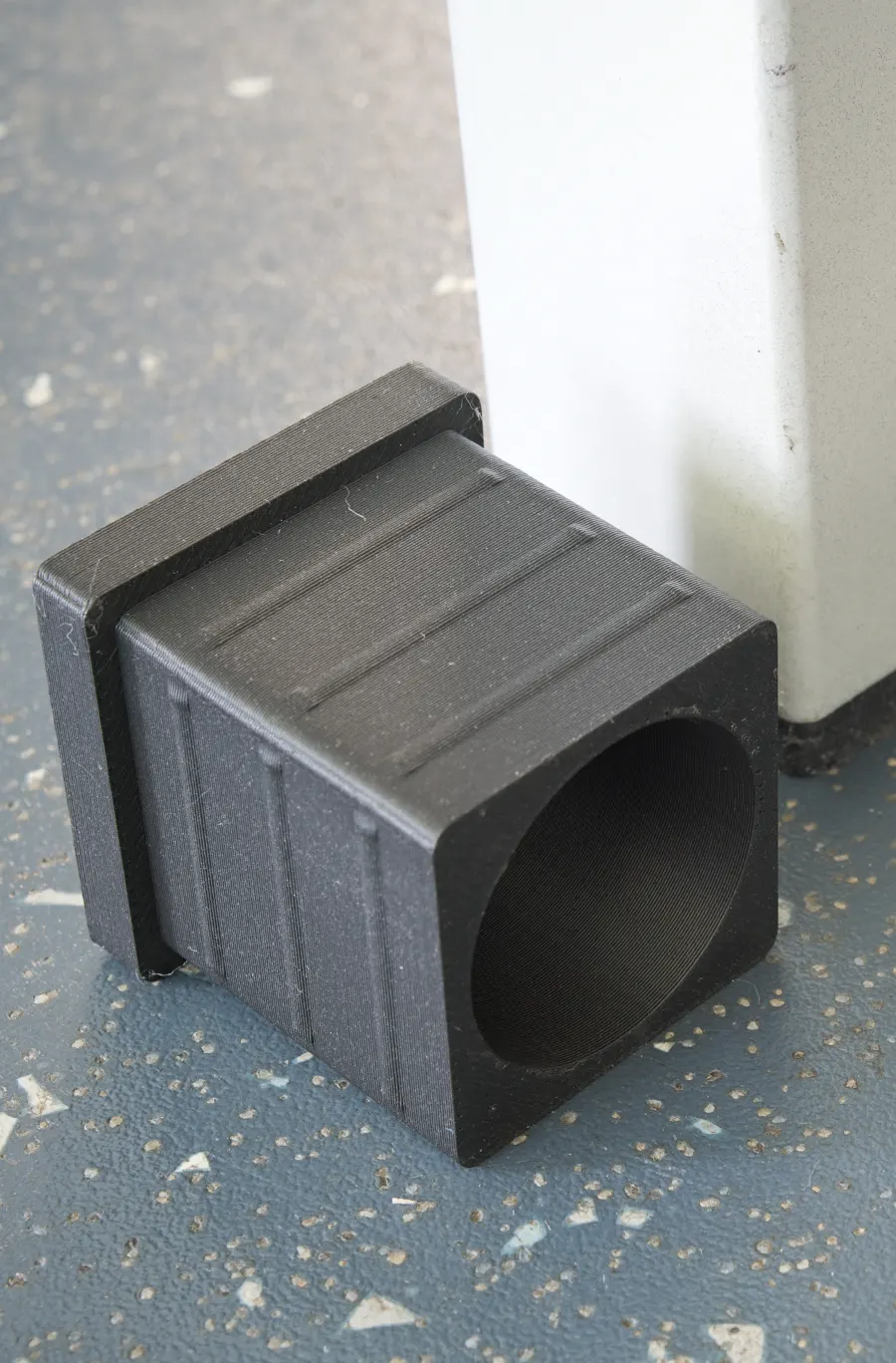Close-up of the layers on a 3D-printed table-leg tip